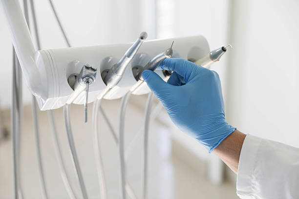 Professional Tooth Extraction technician working in Newaygo County County, MI